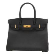 Pre-owned Leather handbags Hermès Vintage , Black , Dames