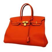 Pre-owned Leather handbags Hermès Vintage , Orange , Dames