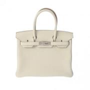 Pre-owned Leather handbags Hermès Vintage , Beige , Dames