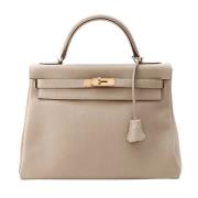 Pre-owned Leather handbags Hermès Vintage , Beige , Dames