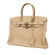 Pre-owned Leather handbags Hermès Vintage , Beige , Dames