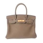 Pre-owned Leather handbags Hermès Vintage , Beige , Dames