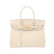 Pre-owned Leather handbags Hermès Vintage , Beige , Dames