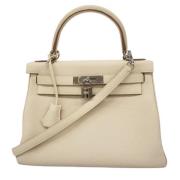 Pre-owned Leather handbags Hermès Vintage , Beige , Dames