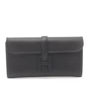 Pre-owned Leather clutches Hermès Vintage , Black , Dames