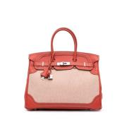 Pre-owned Canvas handbags Hermès Vintage , Orange , Dames