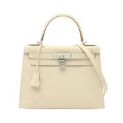 Pre-owned Leather handbags Hermès Vintage , Beige , Dames