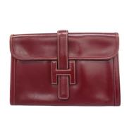 Pre-owned Leather clutches Hermès Vintage , Red , Unisex