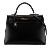 Pre-owned Leather handbags Hermès Vintage , Black , Dames