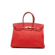 Pre-owned Leather handbags Hermès Vintage , Red , Dames