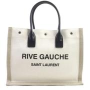 Pre-owned Canvas handbags Yves Saint Laurent Vintage , Beige , Heren