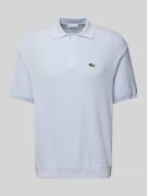 Relaxed fit poloshirt met logobadge
