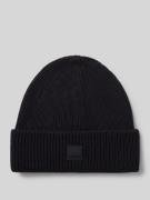 'Beanie met labelbadge