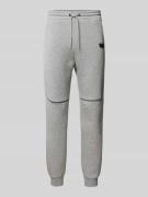 Tapered fit sweatpants met labelprint