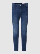 Skinny fit jeans met knoop- en ritssluiting