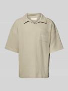 Oversized poloshirt met V-hals