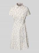 Knielange jurk met strikceintuur