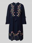 Knielange tuniekjurk met vetersluiting