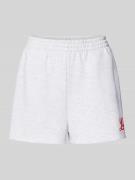 Flared sweatshorts met statementprint