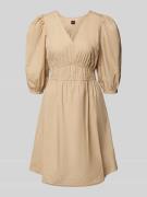 Knielange jurk met pofmouwen, model 'Dezzan'