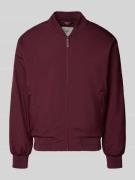 Bomberjack met ritszakken