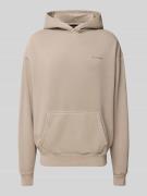 Oversized hoodie met logo en kangoeroezak