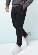 John Devin Sweatbroek Joggingbroek met zijzakken en bindband van katoe...